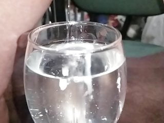 Slo-mo cum in glass of water 