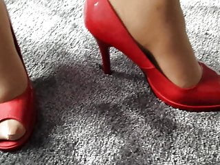 wife modelling in red peep toe heels of another woman