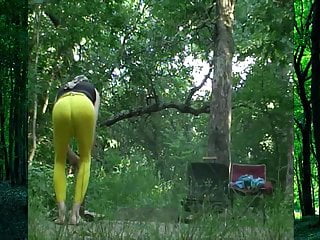 Chopping wood in yellow pantyhose at our campsite.