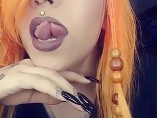 Sexy babe shows off her split tongue