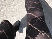 Samantha walking in black OTK socks