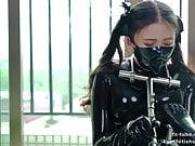 Cute latex girl does metal bondage and breathplay
