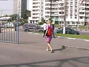 Beautiful blonde walking barefoot in town.
