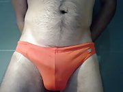 Busting in orange speedos