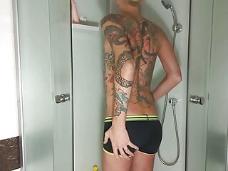 Young guy jerks off shower, ass...