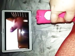 woman masturbates watching video