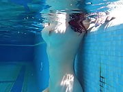 Big tits Sheril goes underwater naked