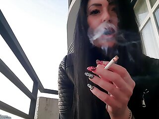 Smoking fetish from sexy Dominatrix Nika. Pretty woman blows cigarette smoke in your face