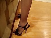 wearing heels and fishnet stockings