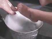 bare feet in a bucket