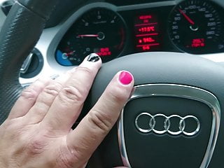 Crossdressed in shiny nylons, dress and heels driving car.