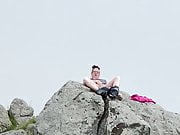 Zoey masturbating in public high up on a rock in the harbor