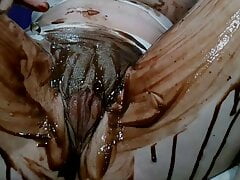 Brazilian_Miss soaking her pussy with chocolate over Clit