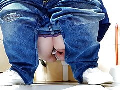 Hot MILF in jeans pissing in a public restroom