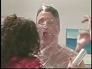 Guy getting wrapped in plastic