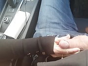 My milf wife jerking cock while driving car