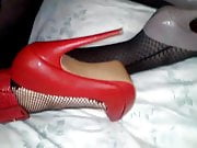 Girl in fishnets and red heels fucked by crossdresser