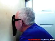 Two guys sharing a mouth in a glory hole