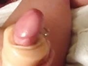Intense cum with a sleeve and view of balls and piercing