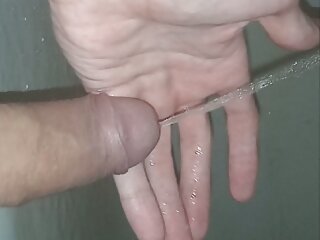 A young guy after a long abstinence wanted to pee and after solitude did pissing right on his hand and in the bath enjoy